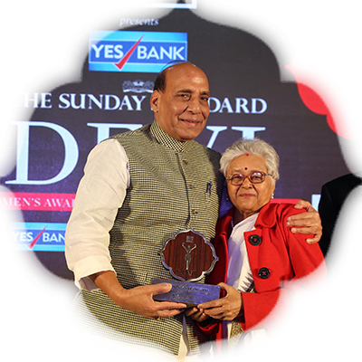 Educationist Dr Bharti Gandhi receives the Devi Award from Union Minister Rajnath Singh in Delhi. Also seen in the picture The New Indian Express Editorial Director Prabhu Chawla.