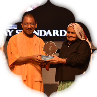 Chandro Tomar being honoured with Devi Awards by Uttar Pradesh CM Yogi Adityanath