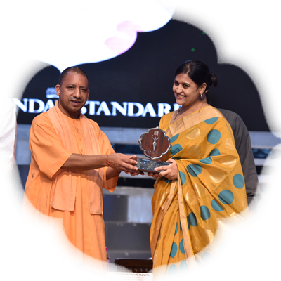 Sapna Upadhyaya being honoured with Devi Awards by Uttar Pradesh CM Yogi Adityanath, in the presence of Prabhu Chawla