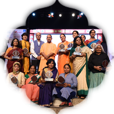 The 11 Devis posing with their awards after the event