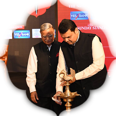 Devendra Fadnavis and Prabhu Chawla light the lamp at Devi Awards for Maharashtra.