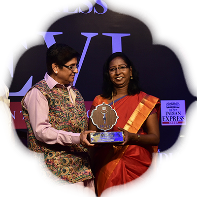 Entrepreneur Kalavathy Sridharan receives the Devi Award from Kiran Bedi as G S Vasu, the editor of The New Indian Express group and TNIE editorial director Prabhu Chawla look on