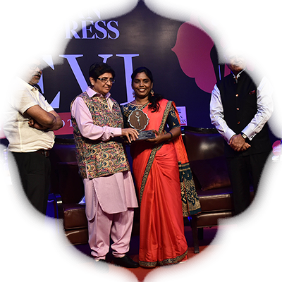 Lyricist Uma Devi receives the Devi Award from Kiran Bedi as G S Vasu, the editor of The New Indian Express group and TNIE editorial director Prabhu Chawla look on