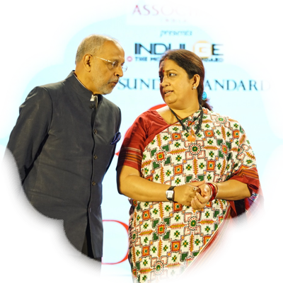 Chairman of the Express Publications Manoj K Sonthalia talks to Smriti Irani as editorial director of the New Indian Express Group Prabhu Chawla looks on