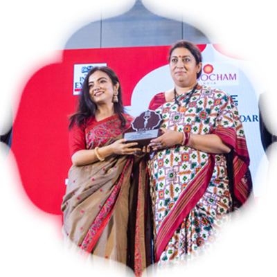Filmmaker Pritha Chakraborty receives her award from Smriti Irani as Manoj K Sonthalia and Prabhu Chawla look on