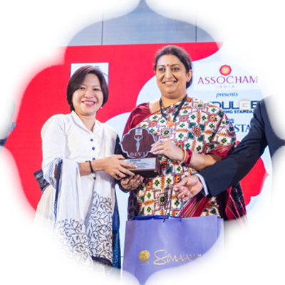 Temsutula Imsong receives her award from Smirti Irani
