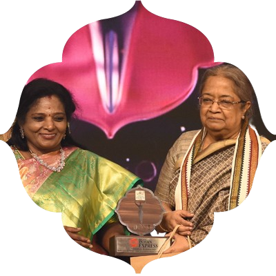 Visalakshi Ramaswamy, receive the Devi award from Governor of Puduchery and Telangana Tamilisai soundararajan