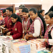 Students checking out books at the bookstall at Odisha Literary Festival, 2017.