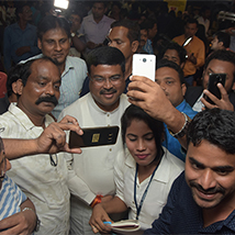 Crowd gathering for a selfie with Union Minister Dharmendra Pradhan