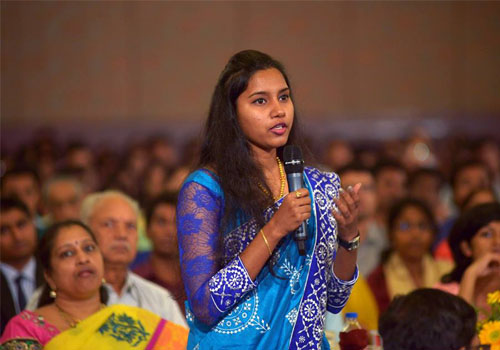 A young college counselor asks question from Sri Sri