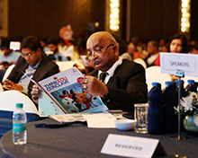 National Law School VC Venkata Rao reads the event brochure