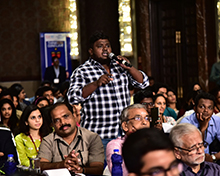A member from the audience poses a question for a panel | (Pic: P Jawahar)