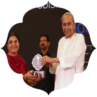 Former Chief Minister Naveen Patnaik presenting Odisha Devi Awards to Ambarmatee sister of Sabarmatee