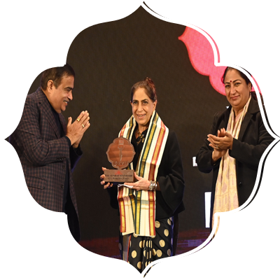 Union Road, Transport and Highways minister Nitin Gadkari, Prabhu Chawla( Editorial Director, New Indian Express) and Delhi CM Rekha Gupta present Devi award to Aditi Mangaldas (Dancer).