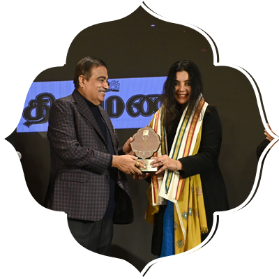 Union Road, Transport and Highways minister Nitin Gadkari, Prabhu Chawla( Editorial Director, New Indian Express) and Delhi CM Rekha Gupta present Devi award to Shradha Sharma (CEO, Yourstory).