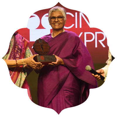 Omana Thomas shines bright as she receives the Devi Award, a testament to her tireless efforts in shaping young minds.