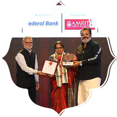 Celebrating Scholar Litty Chacko receives the Devi Award.